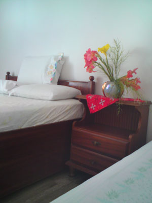 Aggeliki Apartment, Tolo - The lounge area which opens out onto the balcony